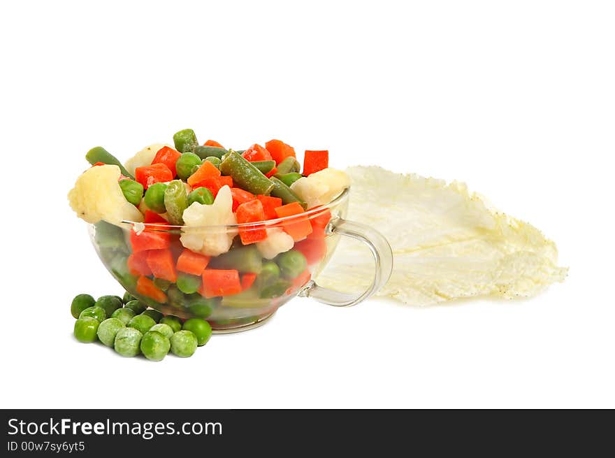 Fresh chinese lettuce leaves and different vegetables in a glass cup on white background. Fresh chinese lettuce leaves and different vegetables in a glass cup on white background