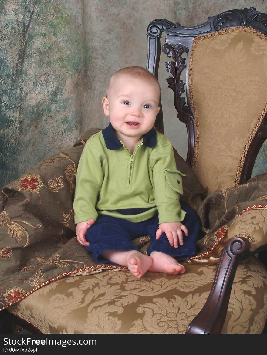 Baby Boy Sitting On Antique Chair