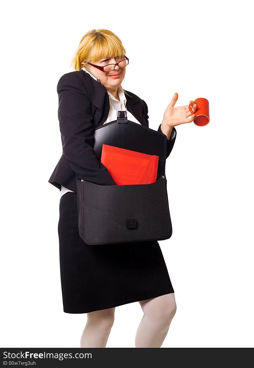 Businesswoman on move with cup coffee calling by phone