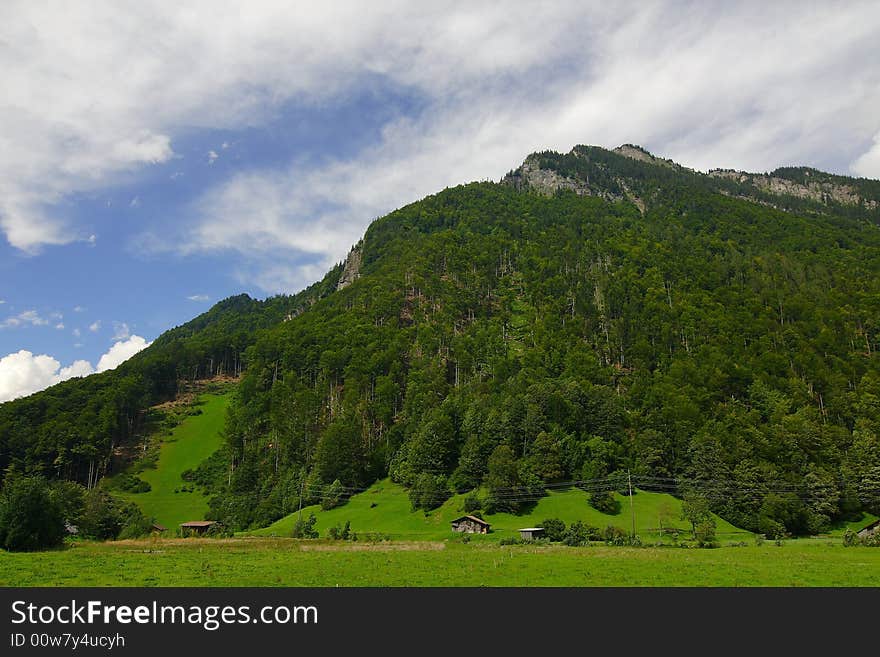 Alpine meadows, mountains and the blue sky. Alpine meadows, mountains and the blue sky