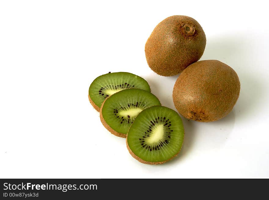 Two kiwis and tree slices