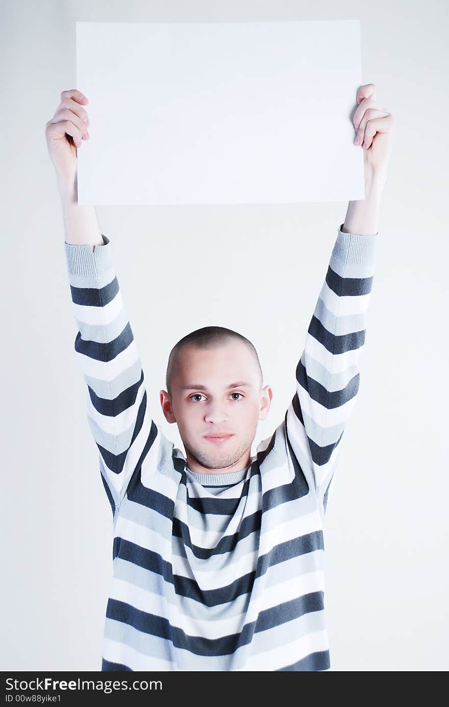 Man takes placard at black background