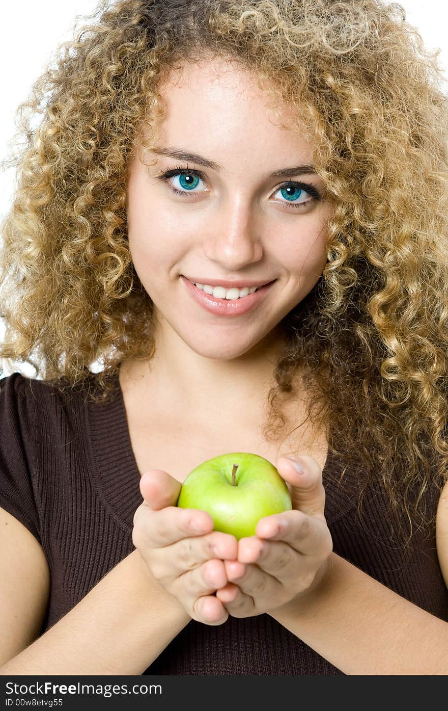 A beautiful young women holding an apple