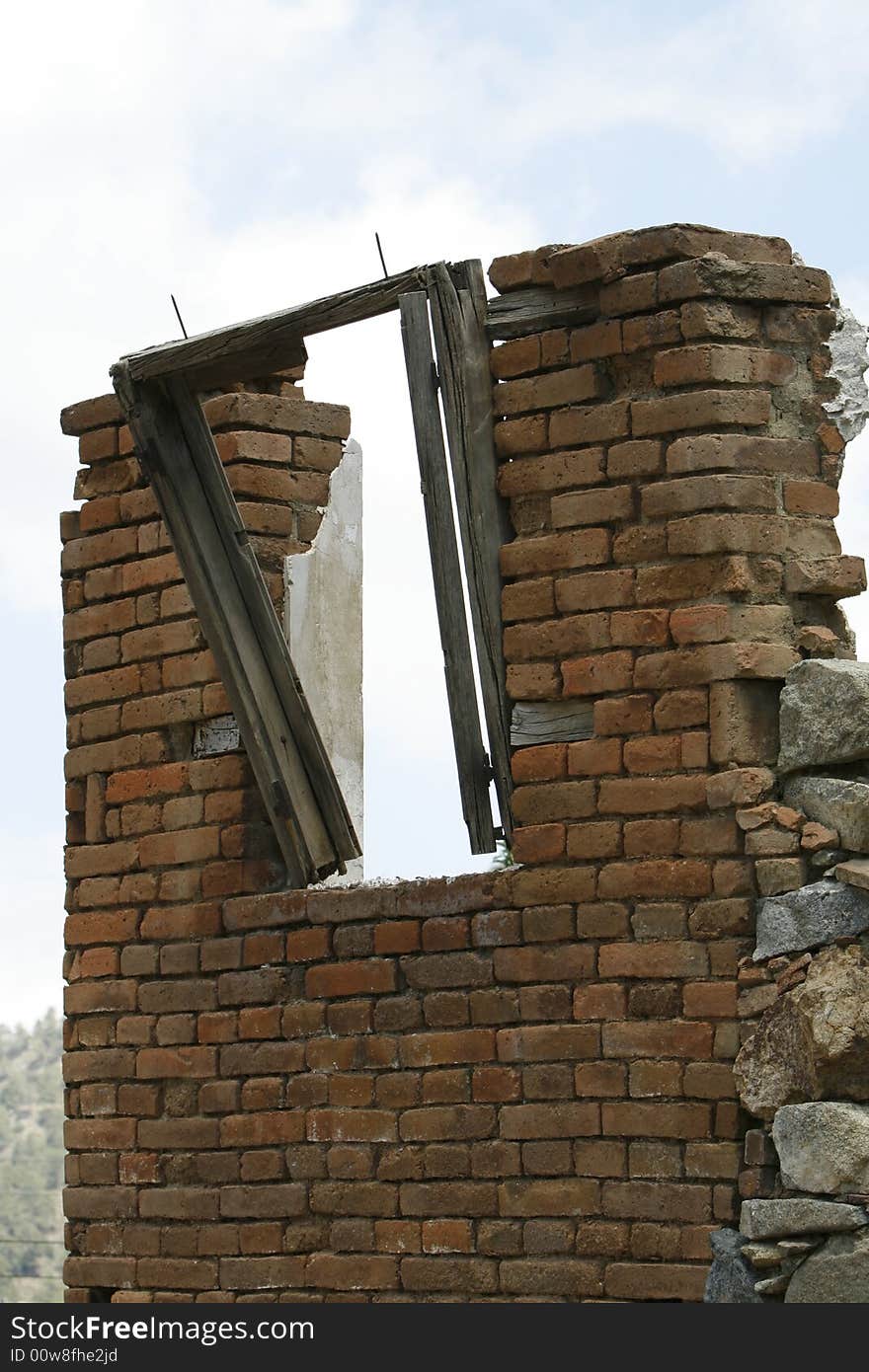 An old wall with a frame window. An old wall with a frame window