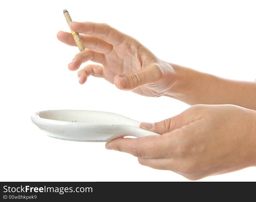 Female hand hold cigarette over ash-tray ,isolated on white