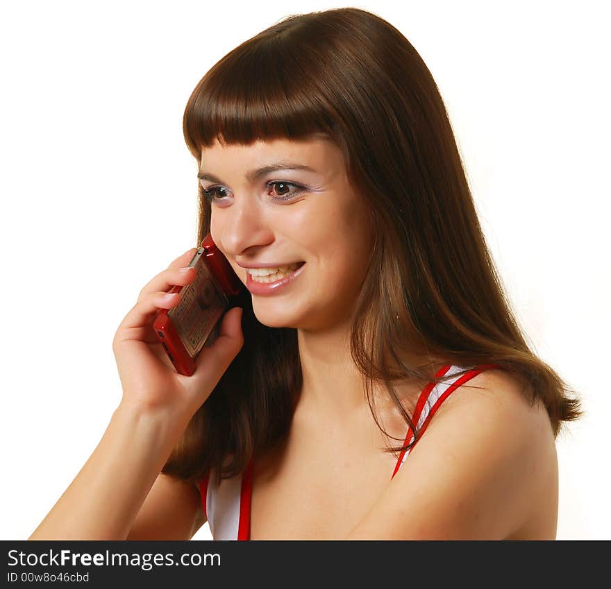 Young beautiful woman talking on the phone. Young beautiful woman talking on the phone