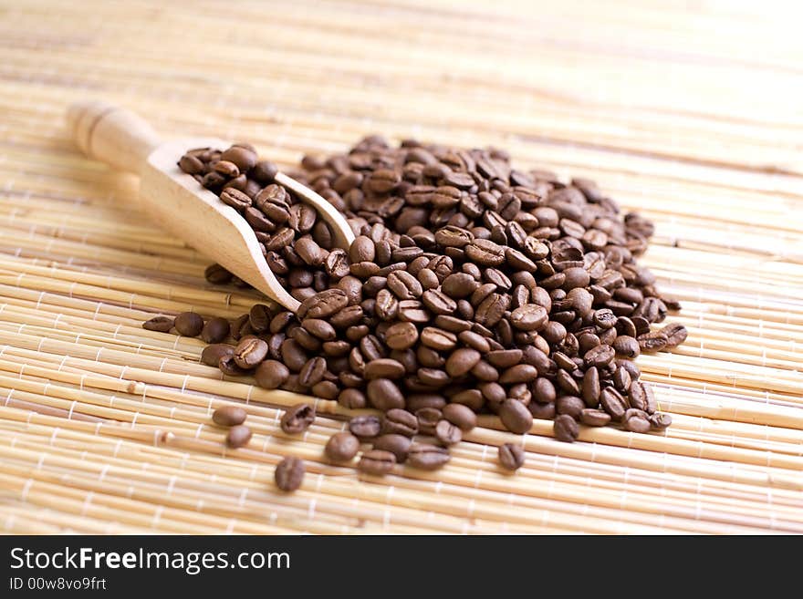 Coffee beans on the bamboo mat.