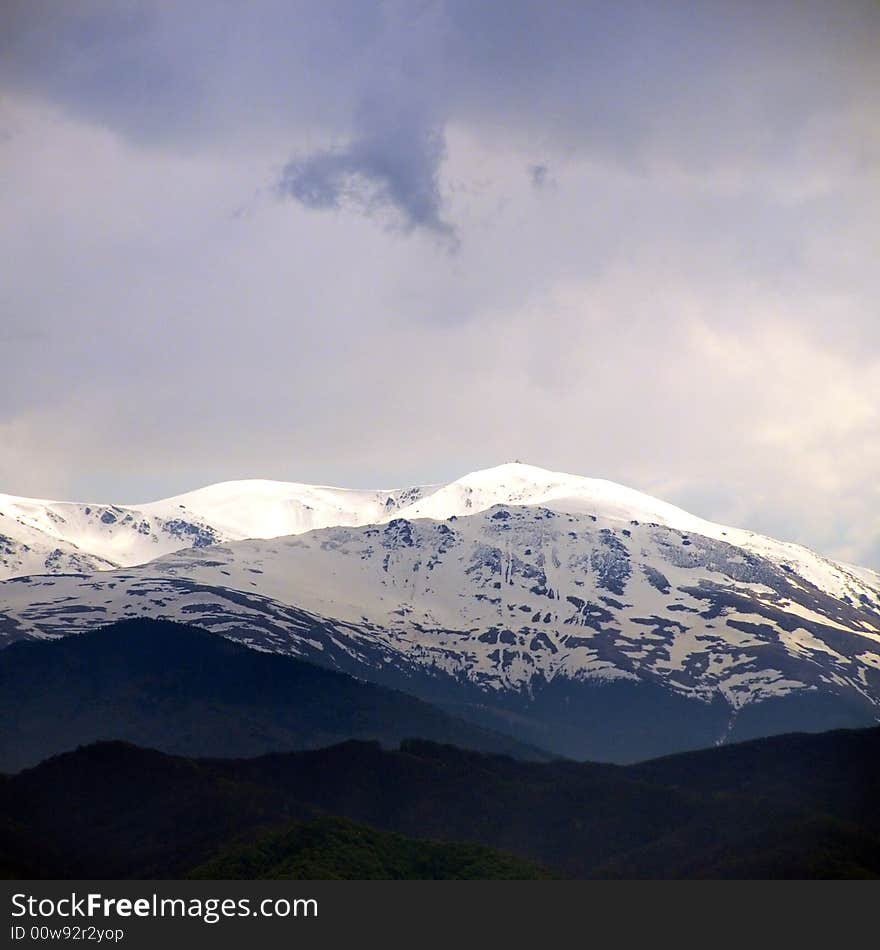 A view with snowy mountain in romania. A view with snowy mountain in romania