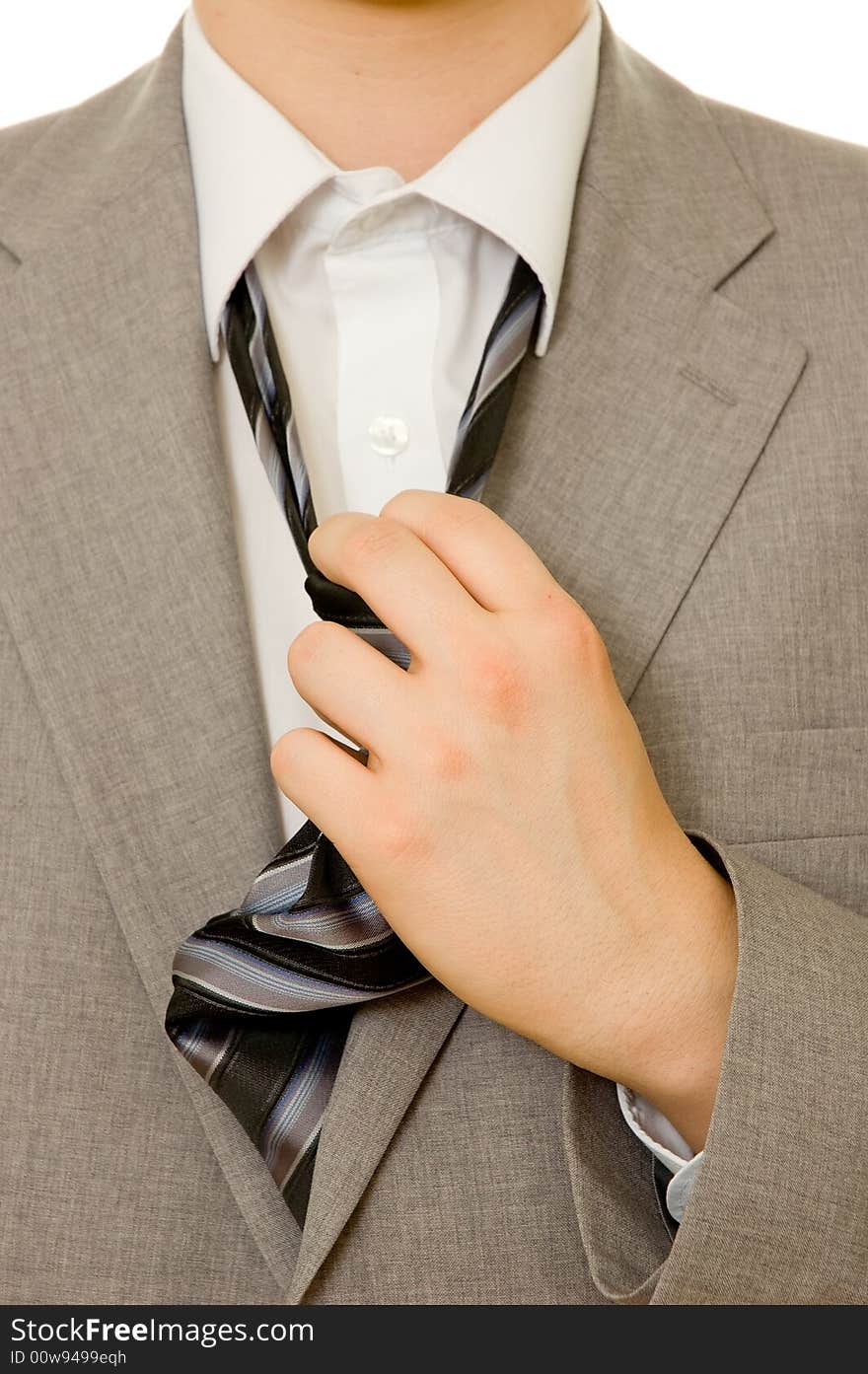 Stressful businessman untying his necktie