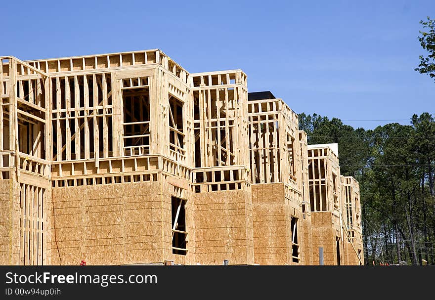 An apartment complex under new construction with wood. An apartment complex under new construction with wood