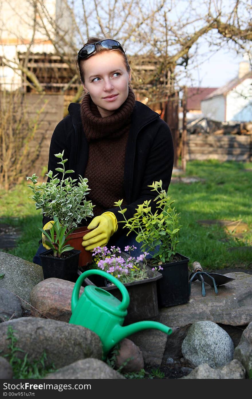 Woman is working in garden. Woman is working in garden