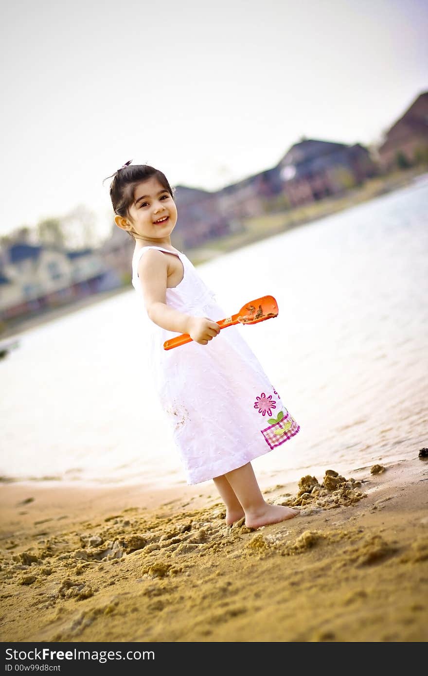 Two year old girl enjoying summer time at the bach. Two year old girl enjoying summer time at the bach