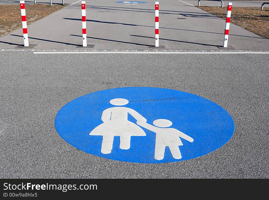 Pedestrian walkway sign on asphalt