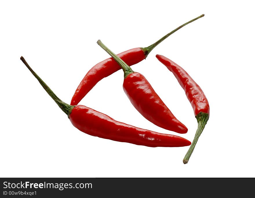 Three isolated hot peppers on white. Three isolated hot peppers on white