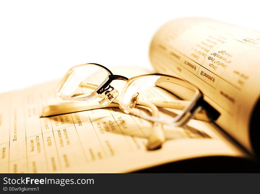 Book and Glasses on white.