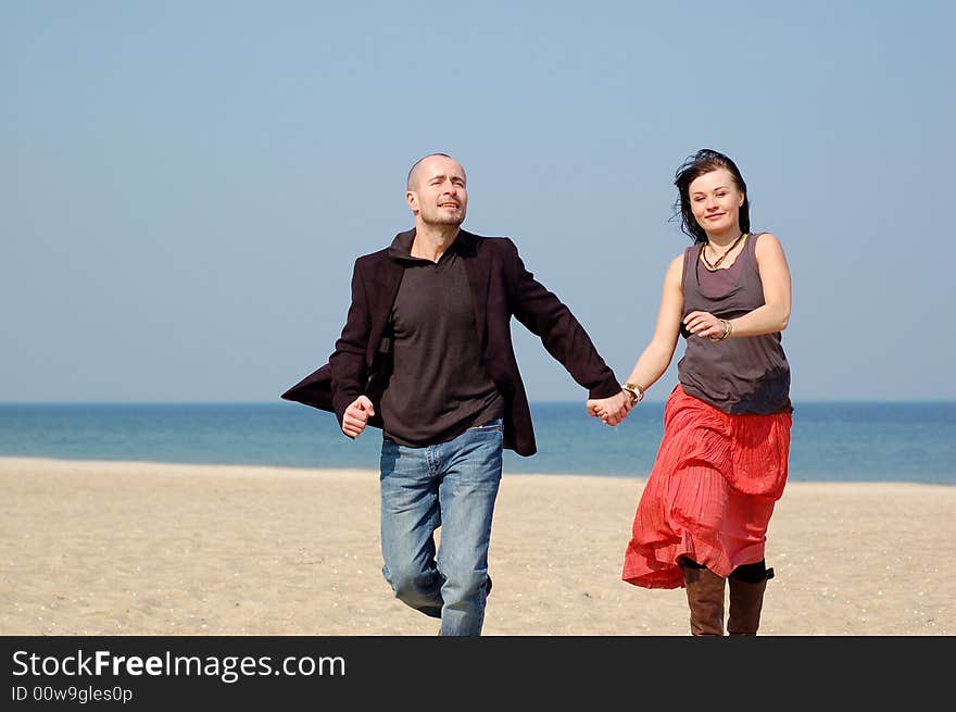 Happy and loving couple on the beach