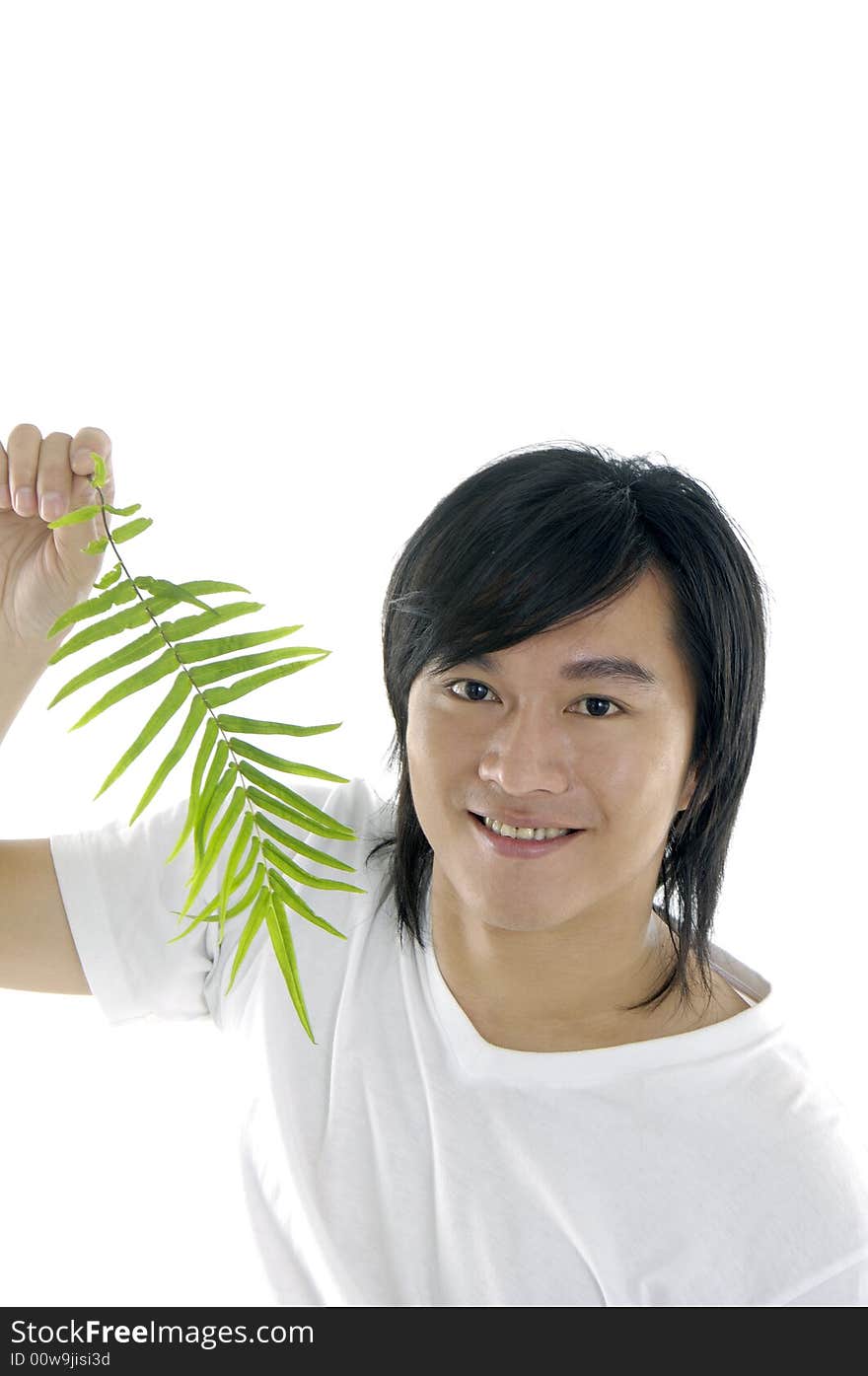 Young man on holding a small plant