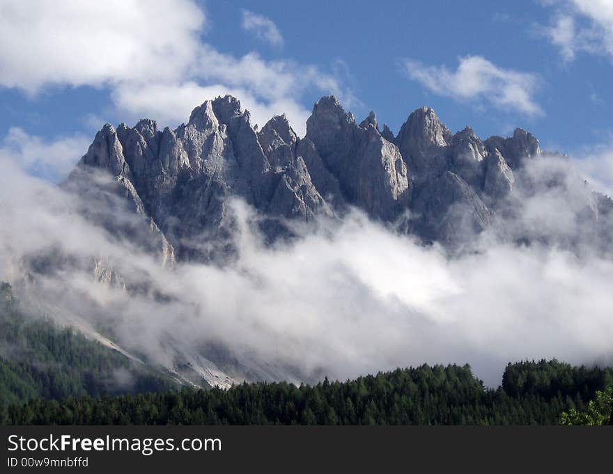 A rock mountain close to the clouds. A rock mountain close to the clouds.