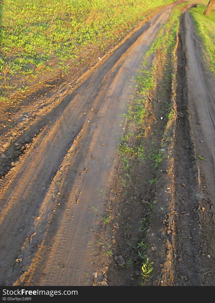 Earth road in rural district, spring, evening. Earth road in rural district, spring, evening