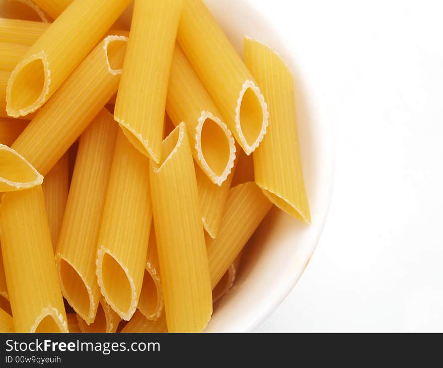 A white plate with delicious Italian pasta. A white plate with delicious Italian pasta