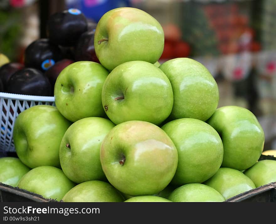 Green apples pyramid on a street market. Green apples pyramid on a street market