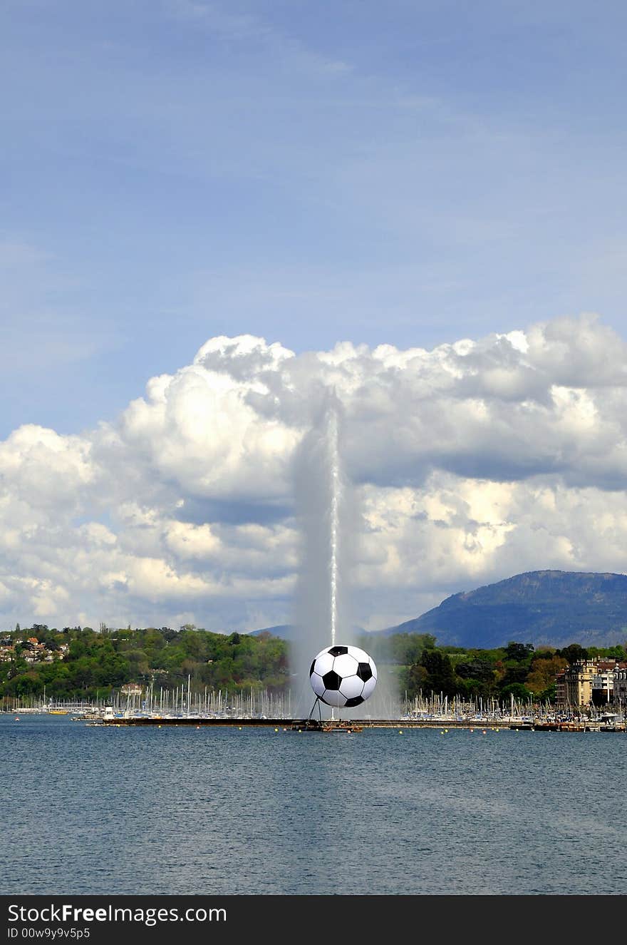 The famous Jet d'Eau fountain in Geneva with giant soccer. The famous Jet d'Eau fountain in Geneva with giant soccer