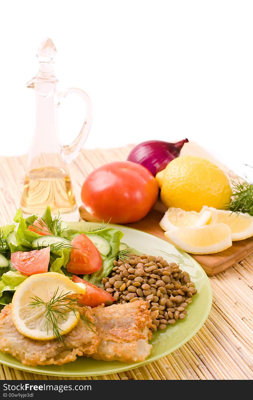 Fried Fish Fillets And Fresh Vegetables