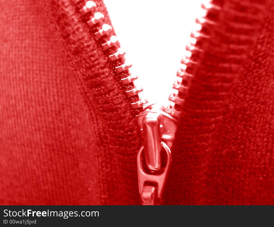 Zipper. Macro. Color clothes. Red and white.