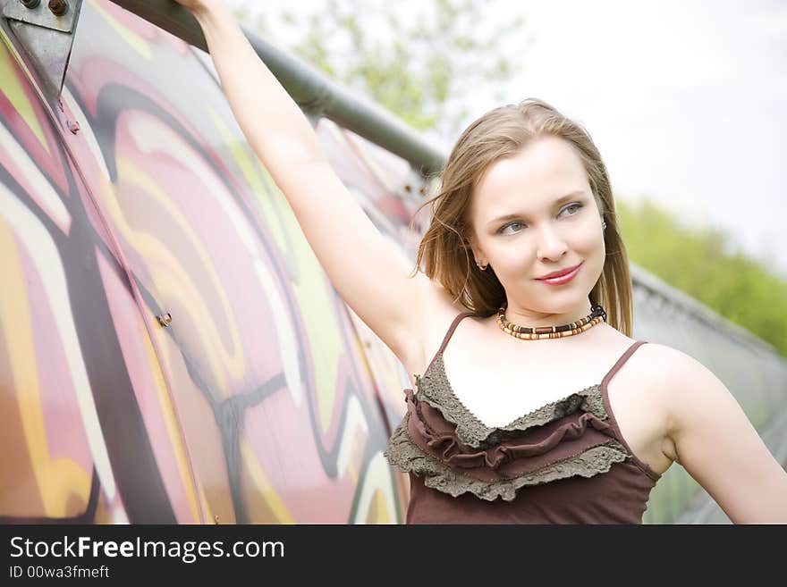 Young Lady Portrait. Graffiti covered tunnel in the background. Young Lady Portrait. Graffiti covered tunnel in the background.