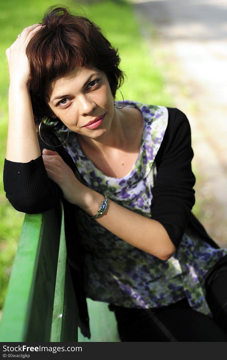 Young woman in a public park. Young woman in a public park