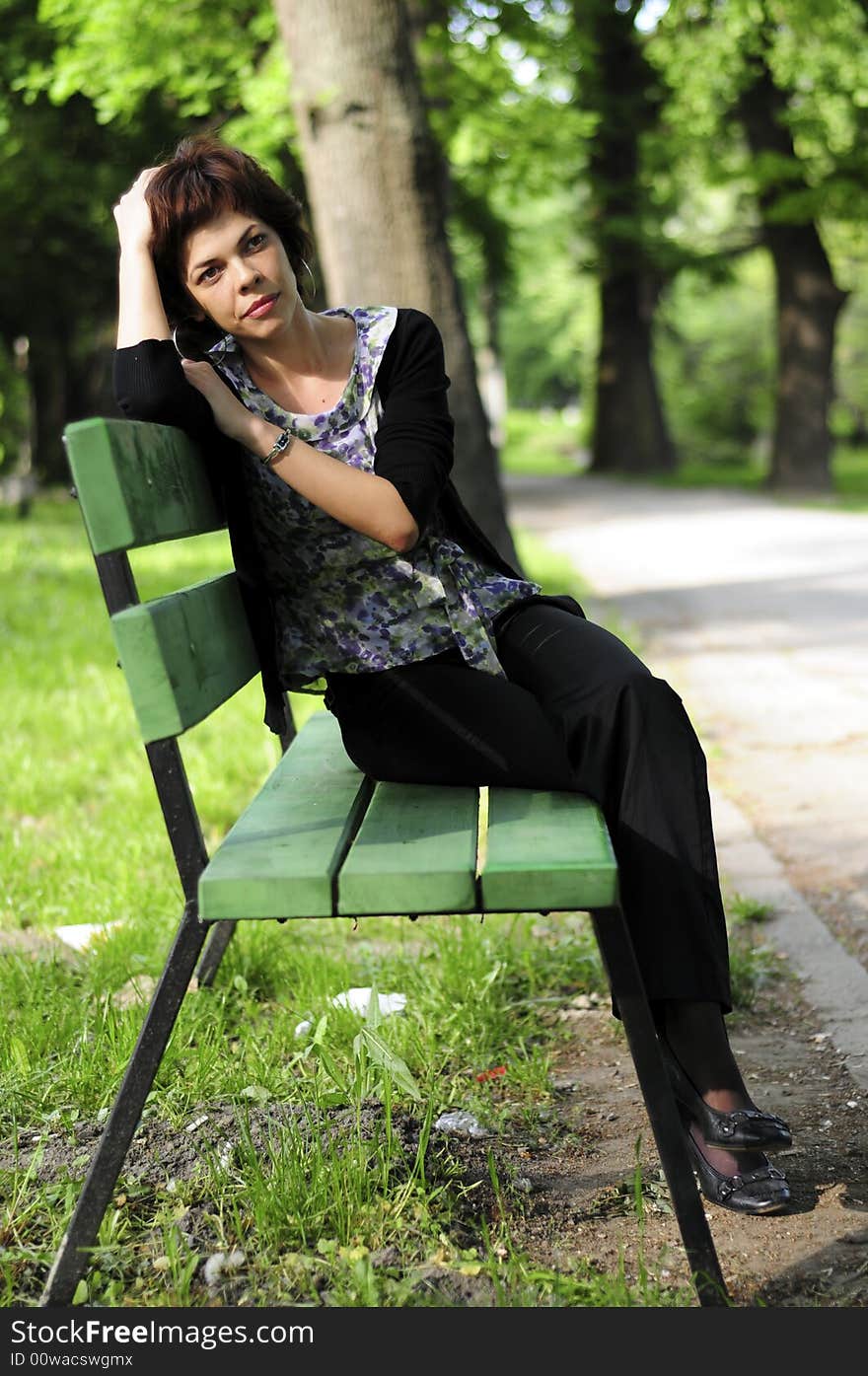 Young woman in a public park. Young woman in a public park