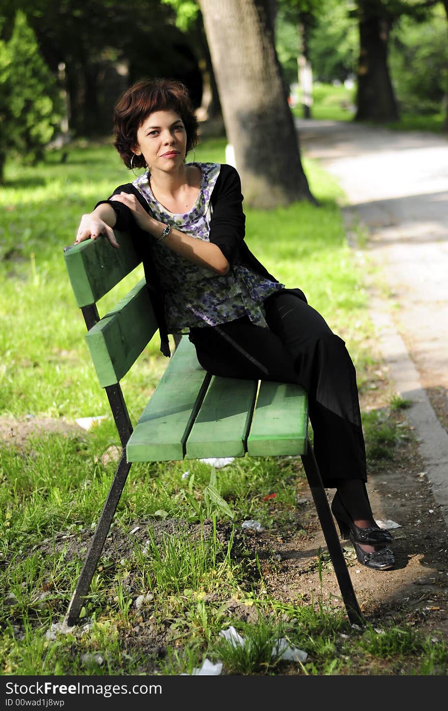 Young woman in a public park. Young woman in a public park