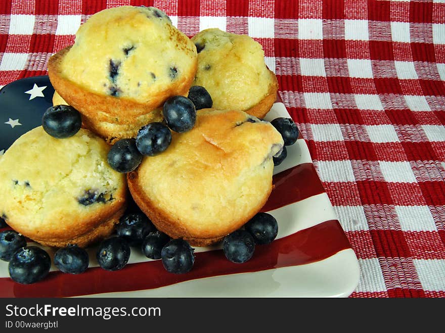 Fresh blueberry muffins on a flag plate. Fresh blueberry muffins on a flag plate.