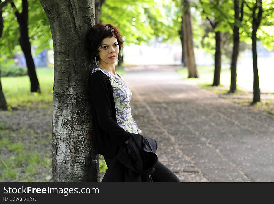 Young woman in a public park. Young woman in a public park