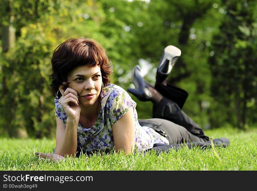 Young woman laid in grass. Young woman laid in grass