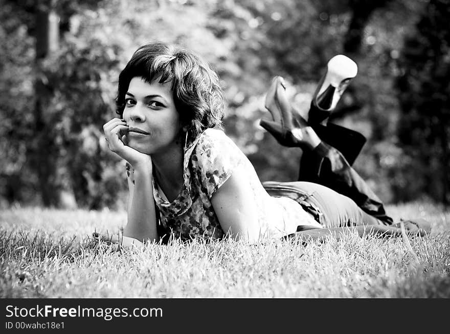 Young woman laid in grass