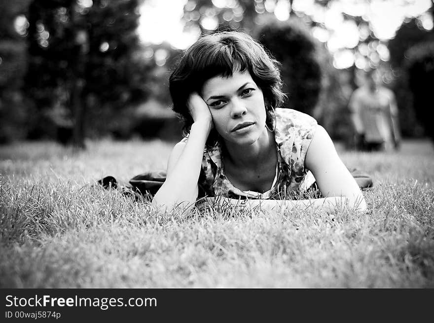 Young woman laid in grass. Young woman laid in grass