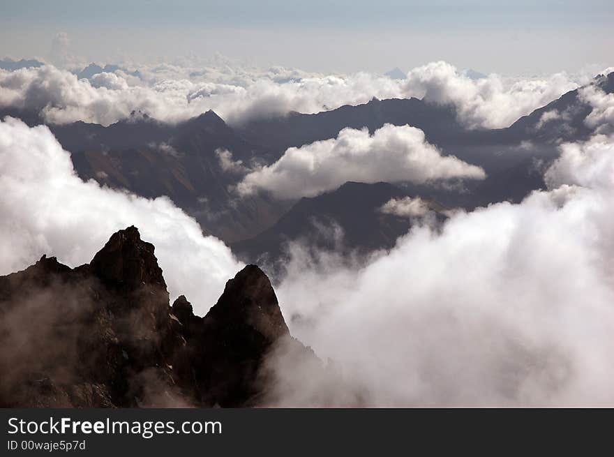 Cloud And Valleys In The Italian Alps