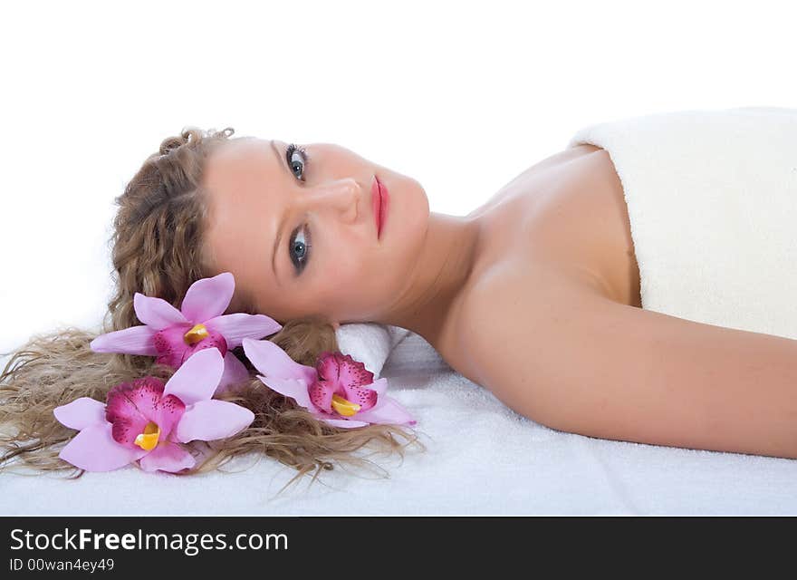 Attractive woman getting spa treatment on white