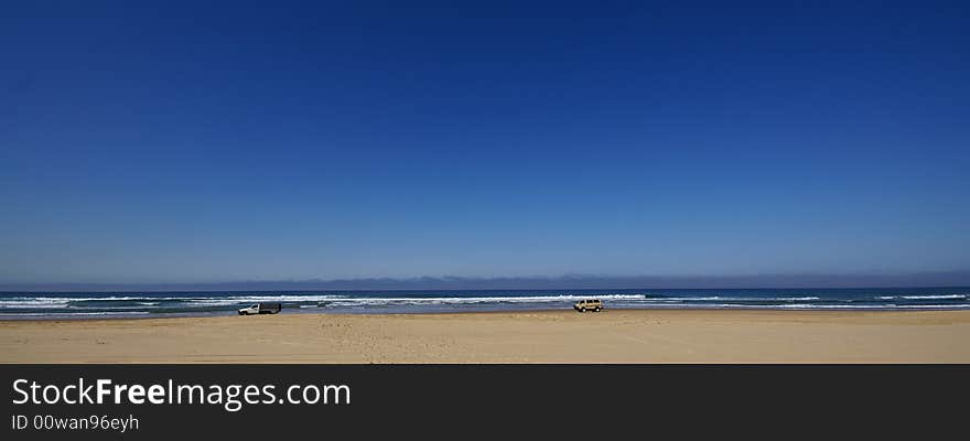 4wd car and van driving on sandy beach. 4wd car and van driving on sandy beach