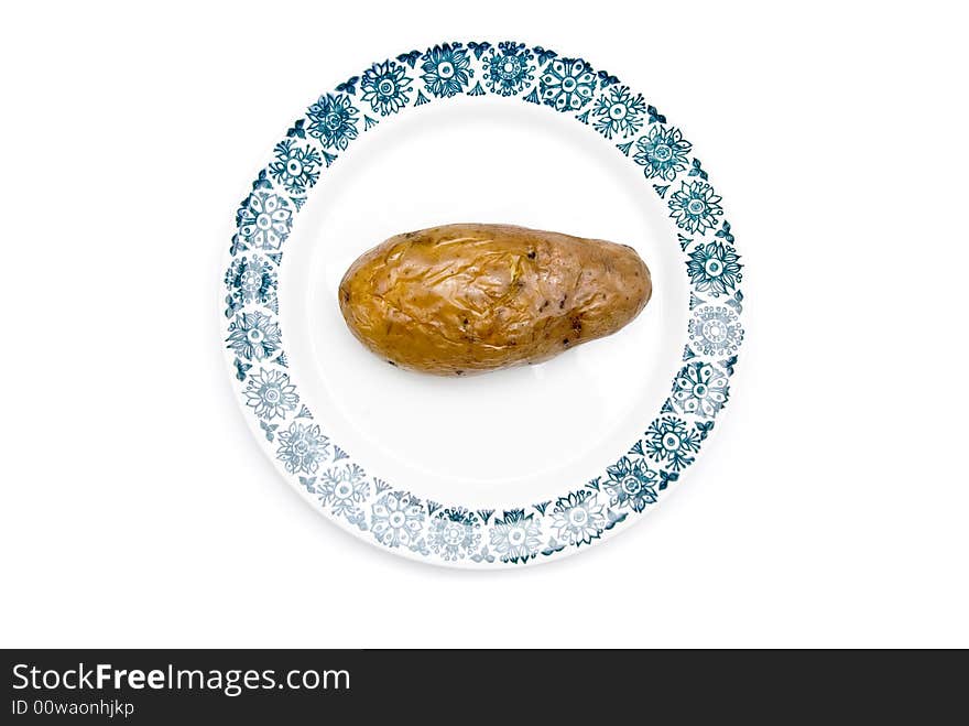 Potato on a plate, isolate on white