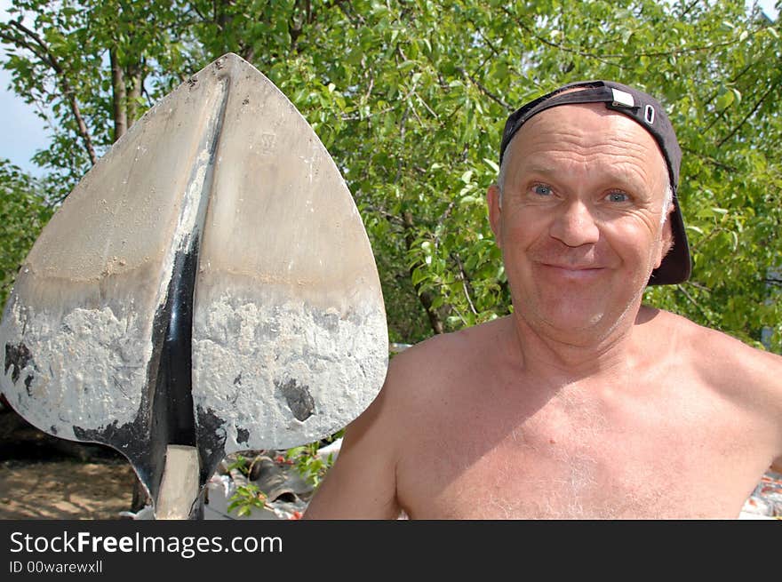 Senior man with spade