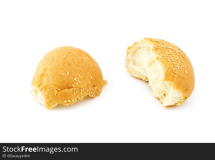 Isolated photo of a broken bun with sesame