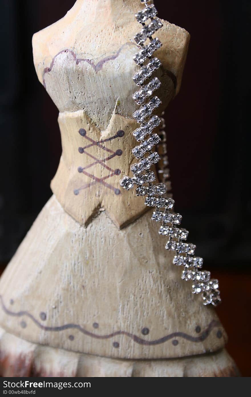 Wooden Jewelery stand with diamond necklace hanging