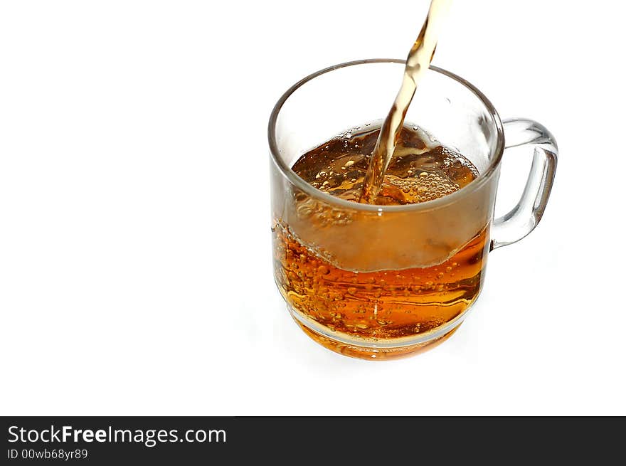 Pouring tea into glassy tea cup. Pouring tea into glassy tea cup