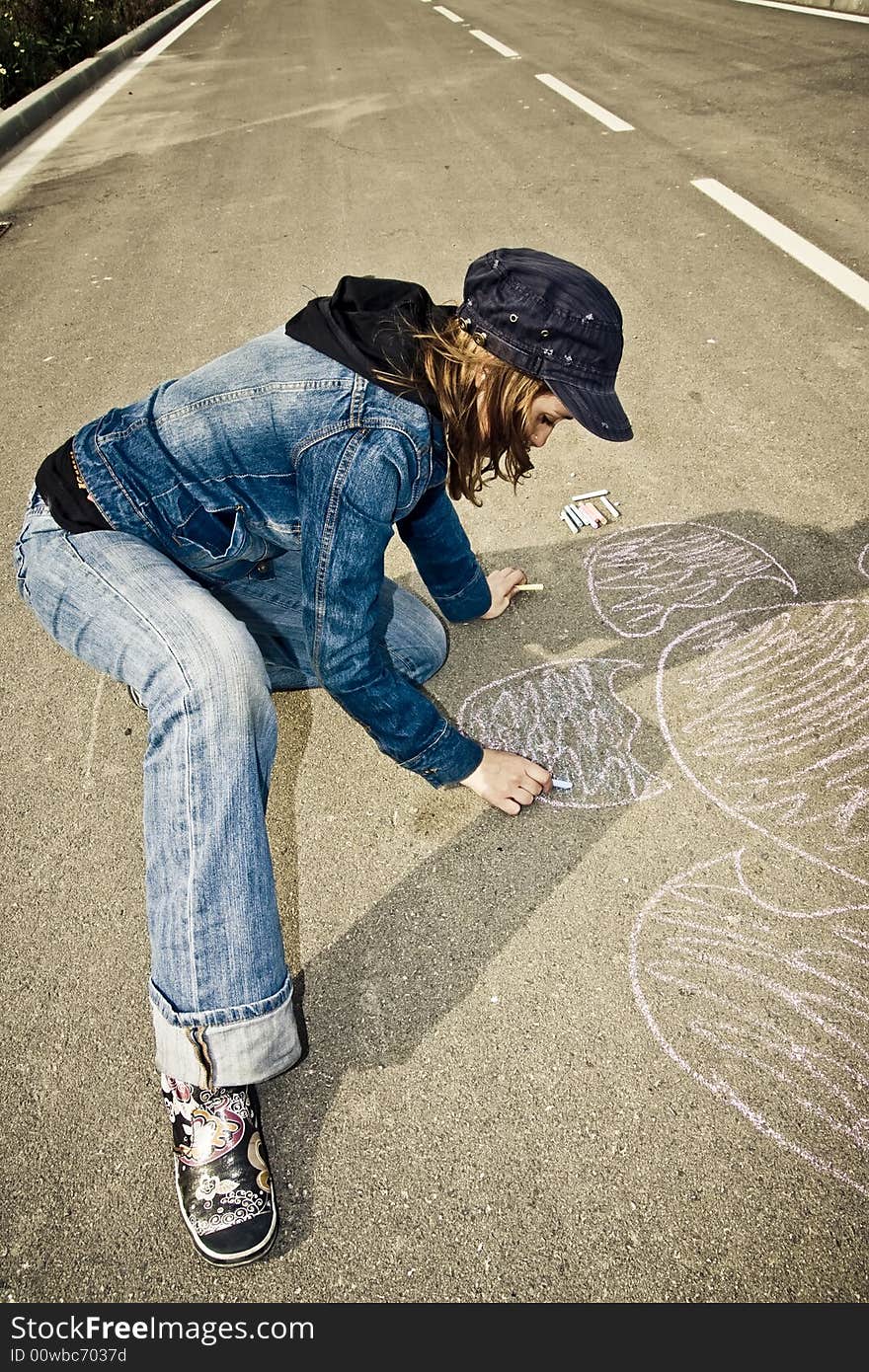 Young artist painting on the street. Young artist painting on the street