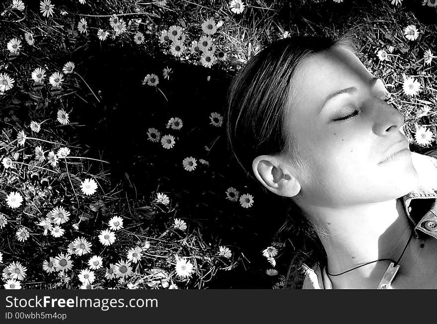 Beautiful young woman in flowers