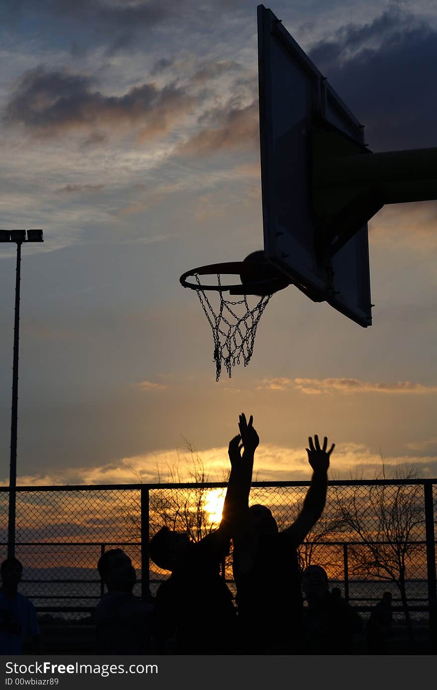 Basketball match at the sunset