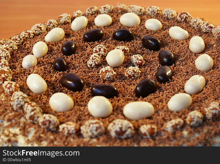 The celebratory ornate chocolate cake on a table. The celebratory ornate chocolate cake on a table