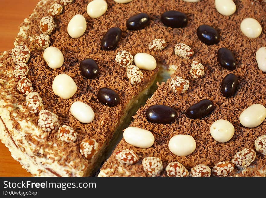 The celebratory ornate chocolate cake on a table